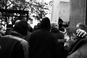 Men in line, waiting for their meal. Athens, Greece Enri Canaj