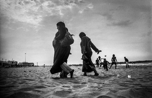 Rabi playing football at the beach of Rabat