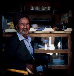 A Kurdish  man With traditional clothes In his own shop from Hawraman Takht ,Kurdistan of Iran