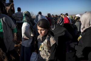 A Kuridsh girl cries during a funeral of YPG and YPJ fighters in the border town of Suruc, Turkey on November 7, 2014.