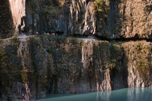 On the upper Nujiang River,, close to the Tibetan border, the vertical limestone cliffs made it necessary for muleteers to cut the path directly into the rock. © Michael Freeman