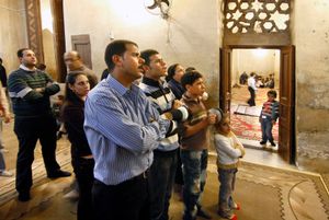 Church goers attending a Coptic Service                                                                             The Coptic World © Bert Spiertz