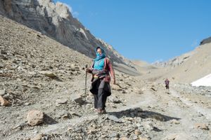 A woman returning to camp after a day's search. Upper Dolpo, Nepal, June 2017.