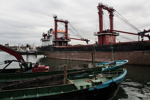 The Marghera port is a sight very far from the beauty of Venice. Rusting steel of large cargo ships and heavy machinery. It lies just a couple of kilometers from the city of Venice.