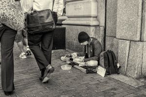 Man eating a sandwich on Mass Ave in Cambridge, Massachusetts