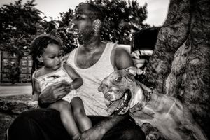 O'Neil Dambruck after work, with daughter and doggy