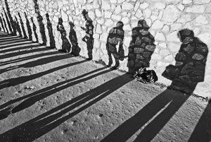 'Shadows of Civility Cast in Stone  While Awaiting a Tardy Bus'