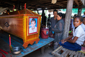Family and friends mourn the death of 22 year-old Reom Soroun, one of two factory workers who died after a building collapsed at Wing Star shoe factory. Soroun left behind his wife and newborn baby.