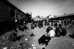 Mealtime at makeshift shelter near  Belgrade main train station.  Belgrade, Serbia.