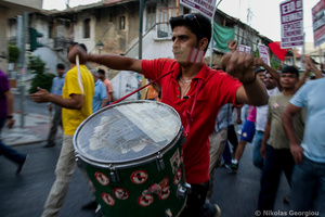 Refugees and migrants shout slogans against racism as the stage a demonstration to protest over racist attacks by neo-nazis. July 5, 2012, Athens, Greece