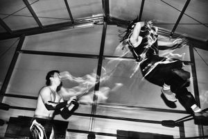 Ultimo Sombra lunges towards Shiho with a springboard back elbow.