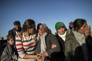 A Kurdish woman reacts during a funeral of YPG and YPJ fighters in Suruc, Turkey on November 7, 2014.