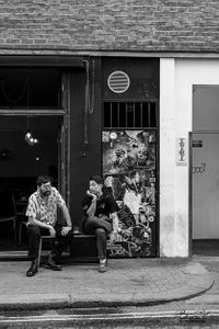 Two men chatting in Soho