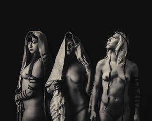 "The Divine Trinity" – my seventh photograph in the series, is a combination of both my cultures, as I spent my life between the Jewish Israel and Catholic Ireland. The combination of the Holy Trinity and the Shekhina (The female spirit of God in the Jewish tradition) within the naked bodies wrapped in the traditional Jewish prayer wear (pre Christianity).