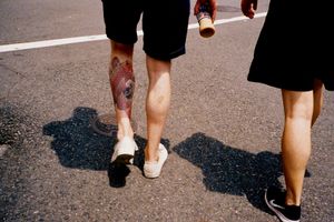 Tokyo heatwave. Tourist with Japanese-style tattoo