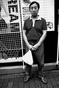 A man stand up in Korean part of Shinjuku