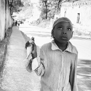 Portrait of little girl with a sardine.