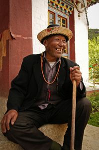 This pilgrim sat to rest on the steps of the main temple at Lamaling or Lama-Lin Monastery is about 30km south of Bayi, Tibet. Photographed on 4 July 2005. © Forest McMullin