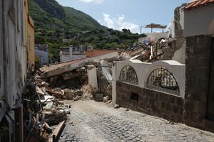 The totally collapsed house where Ciro and his two little brothers were rescued.