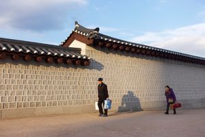 A man and a woman with lots of bags.