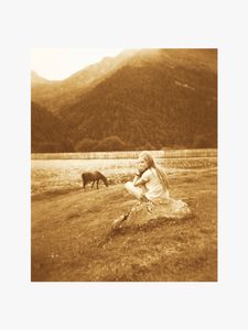 Girl sitting on a stone
