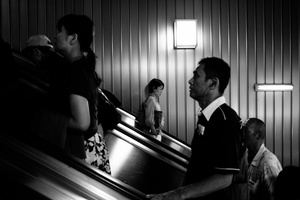 People use escalator inside Shinjuku station