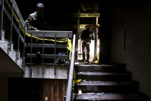 Survivors rescue their personal belongings in El Valle Building, after an airplane crashed into the building.