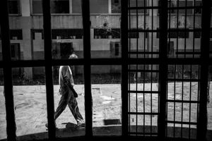 An inmate walks in front a security glass in Rodeo III jail, the jail in 2012 were the scenario of a major intervention where at least 19 inmates were killed.