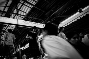 People get in and get ou of a platform in Shinjuku JR station