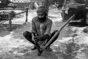 Man sharpening digger  | Dhanda, Punjab.