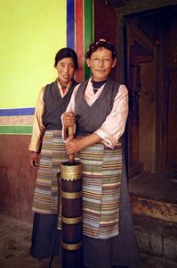 These women are villagers at Mindroling Monastery near Dranang, Tibet. They were photographed with a churn used for making yak buttter tea on 1 July 2005. © Forest McMullin