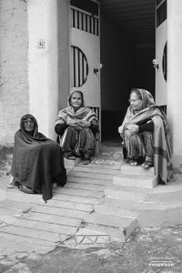 Three women on steps | Dhanda, Punjab.