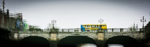 Dublin bus on bridge over the river