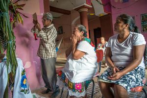 Don Mario Kahuil reads prayers in Latin, Spanish and Maya.
