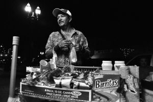 Juan buying a burrito at a street stand.  © Joseph Sorrentino