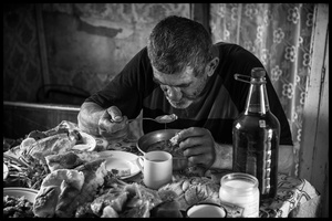Around noon Hovik takes his first meal of the day.