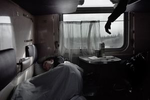 Dimas, 19 years old coal miner. Sleeping on the train on his way to the coal mine, located at 15 hours by train from his home. Komi Republik.