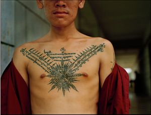 Policeman 'protected' from AIDs, by tattoo, Cambodia  2001