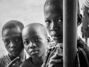 Portrait of children in front of their school during a break.