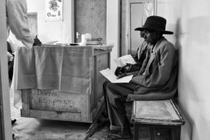 Many patients started at dawn for a walk which would take several hours. Arriving at the medical clinic, eager patients waited patiently for the clinic to begin at 8AM.                    © Lola Reid Allin