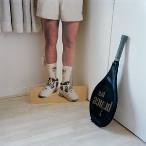 John McEnroes' Legs and Afsaneh's Racquet, Putney, 2014 © Ali Mobasser