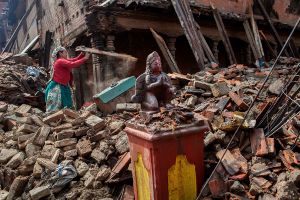 An undamaged statue of Hindu Goddesses in front of a broken temple at Bhaktapur, Nepal, 09 May 2015.