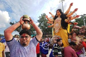 Immersion procession in progress. It is the last day of Durga Puja when the idol is immersed at the holy river Ganges.