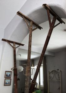 Amalia shows the damages in her house.
