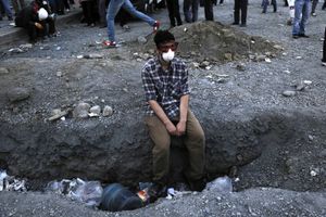 A protester takes a rest during the clashes between anti-government protesters and riot police in Taksim square in Istanbul, Turkey on Tuesday, June 11, 2013.