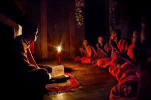 Thala District (Stung Treng province), Cambodia Dec 2009. Young monks are studing the prayers. The electricity does not reach the district Thala.?This monastery (with annex orphanage), has couple of hours a day of electricity thanks to an old generator. This district is one of the poorest in Cambodia with very high percentual of HIV positive people.