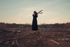 As The World Collapses Around Her