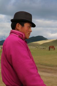 Young Mongolian in a Pink Deel. Orkhon Waterfall, Central Mongolia. 2017.