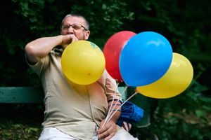 Man with many balloons