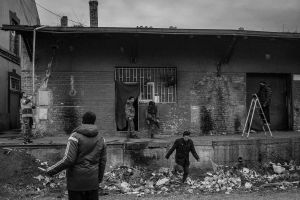 A group trying to reach a ball from the roof top